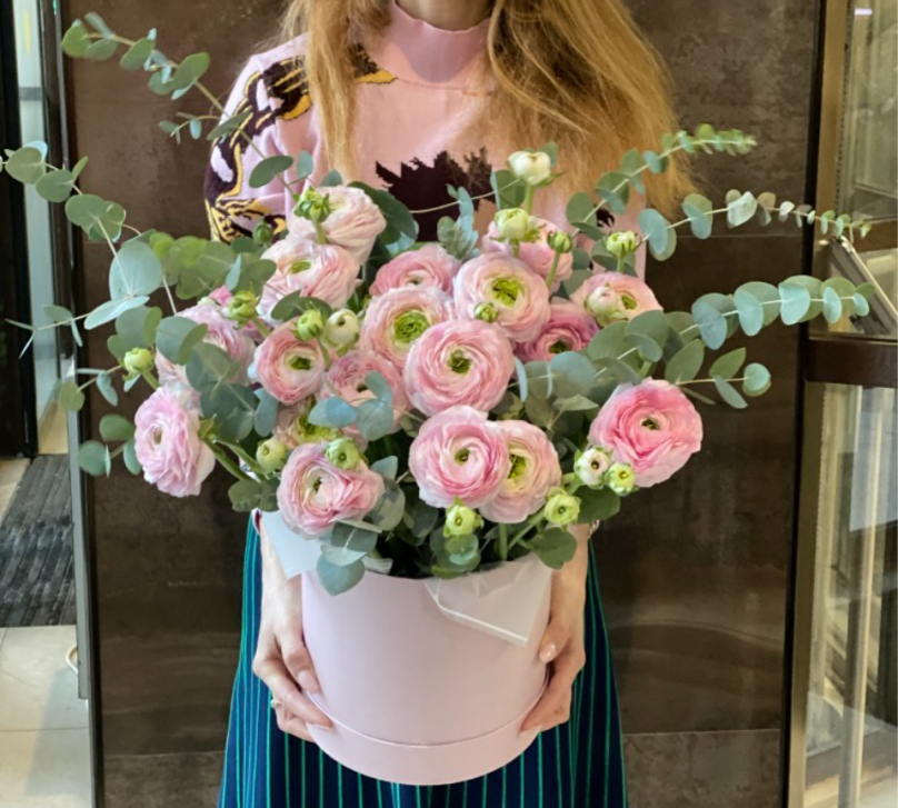 Ethereal Charm: 29 Ranunculus With Eucalyptus