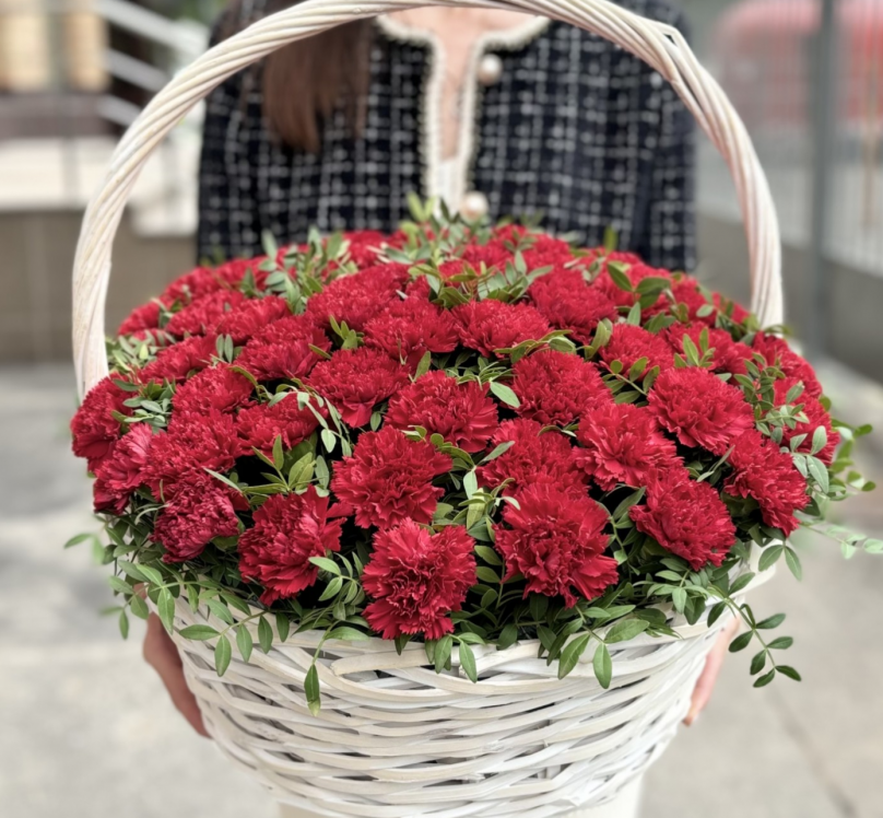 Fireside Mirage: 55 Red Carnations in a Basket